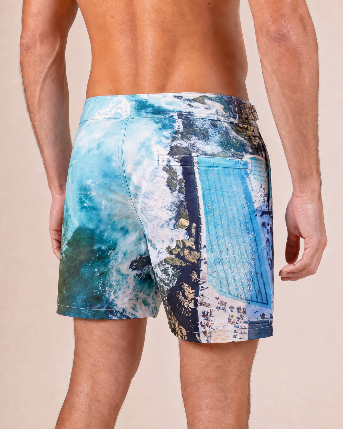 RWENZORI Bondi photo print swim shorts — close-up rear view.