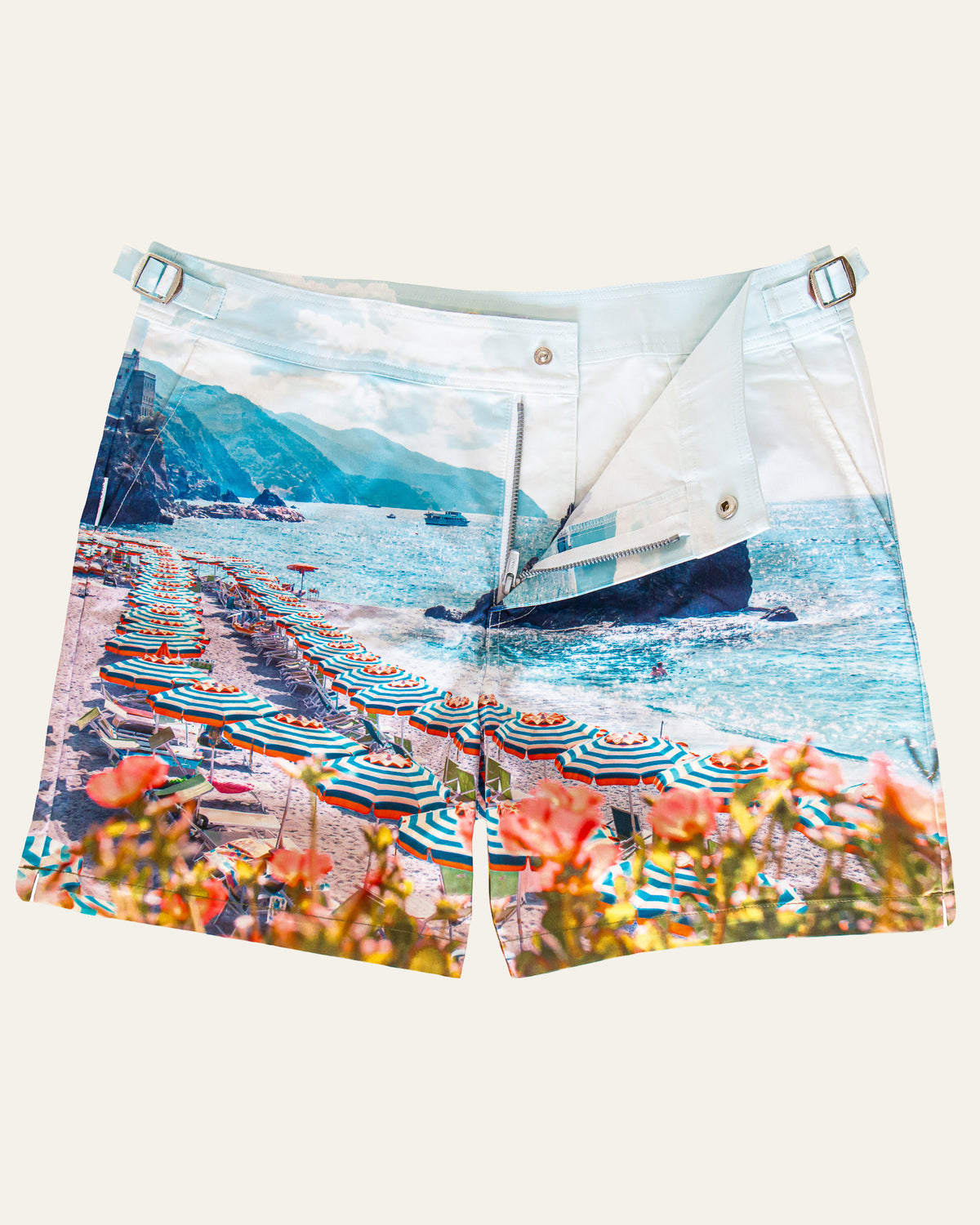 Flat lay front view of RWENZORI Cinque Terre photo print swim shorts on a clean background.