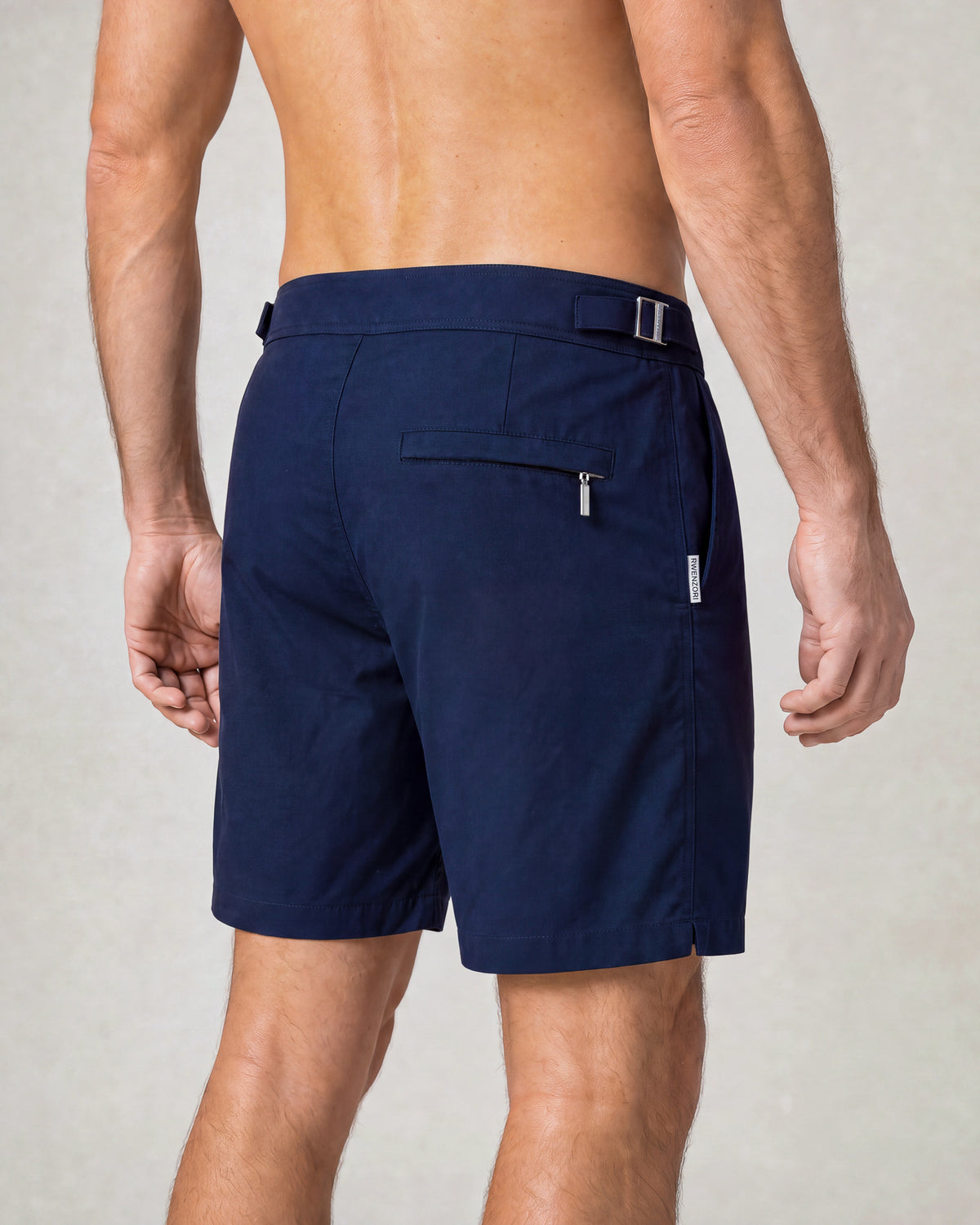 Man wearing RWENZORI Performance Series Swim Shorts Nautic Navy rear closeup.