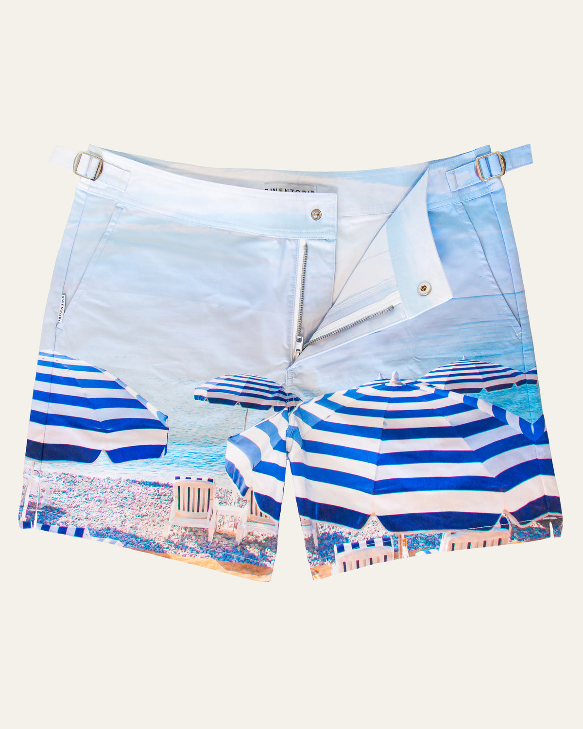 Flat lay front view of RWENZORI St Tropez photo print swim shorts on a clean background.