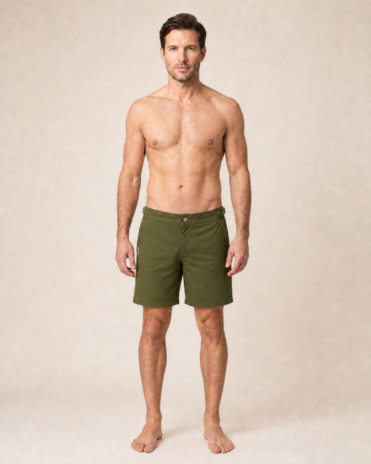 RWENZORI Tuscan Olive Performance Series swim shorts — full-frame front view.
