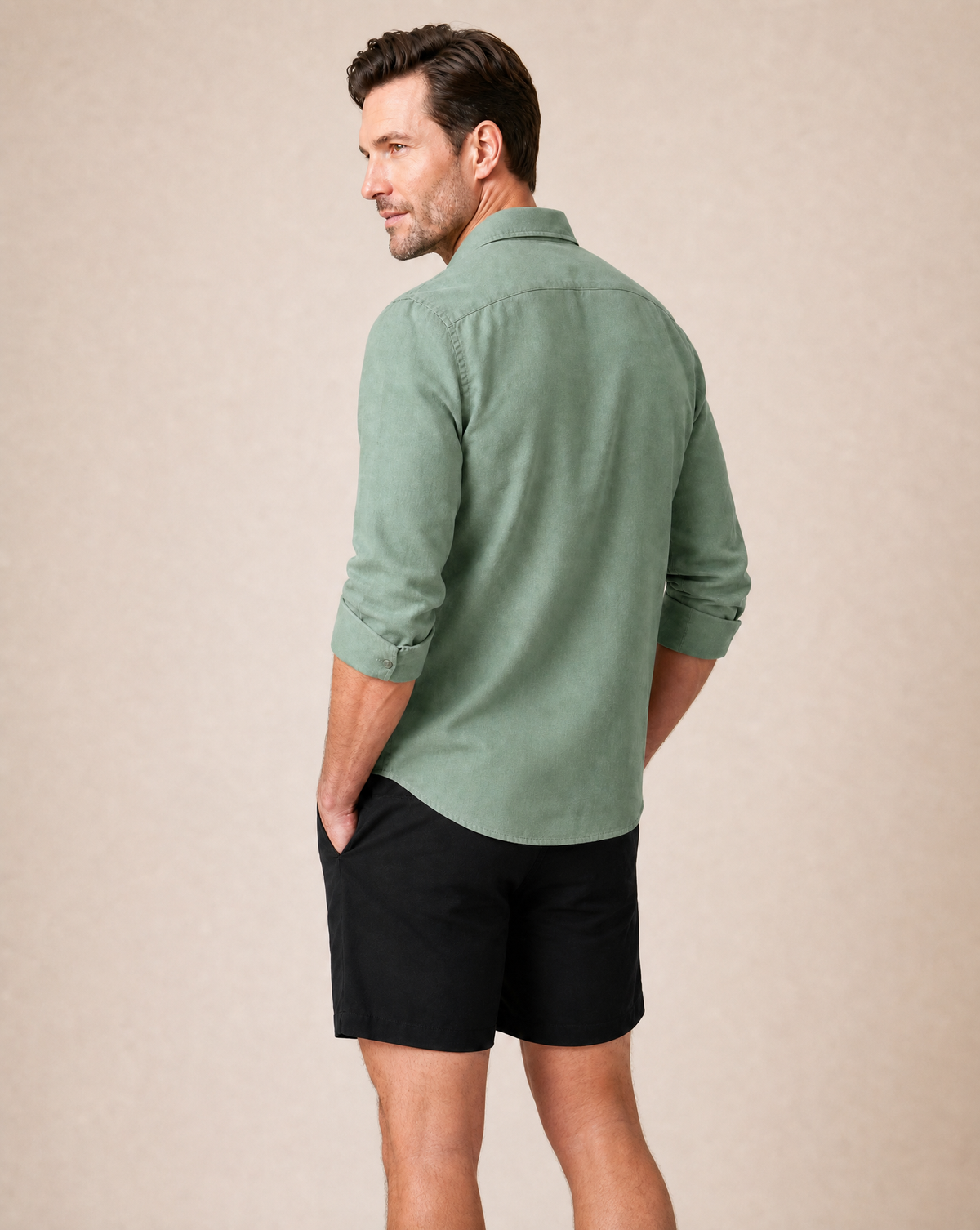 Back view of the tailored fit on Rwenzori men's sage linen shirt.