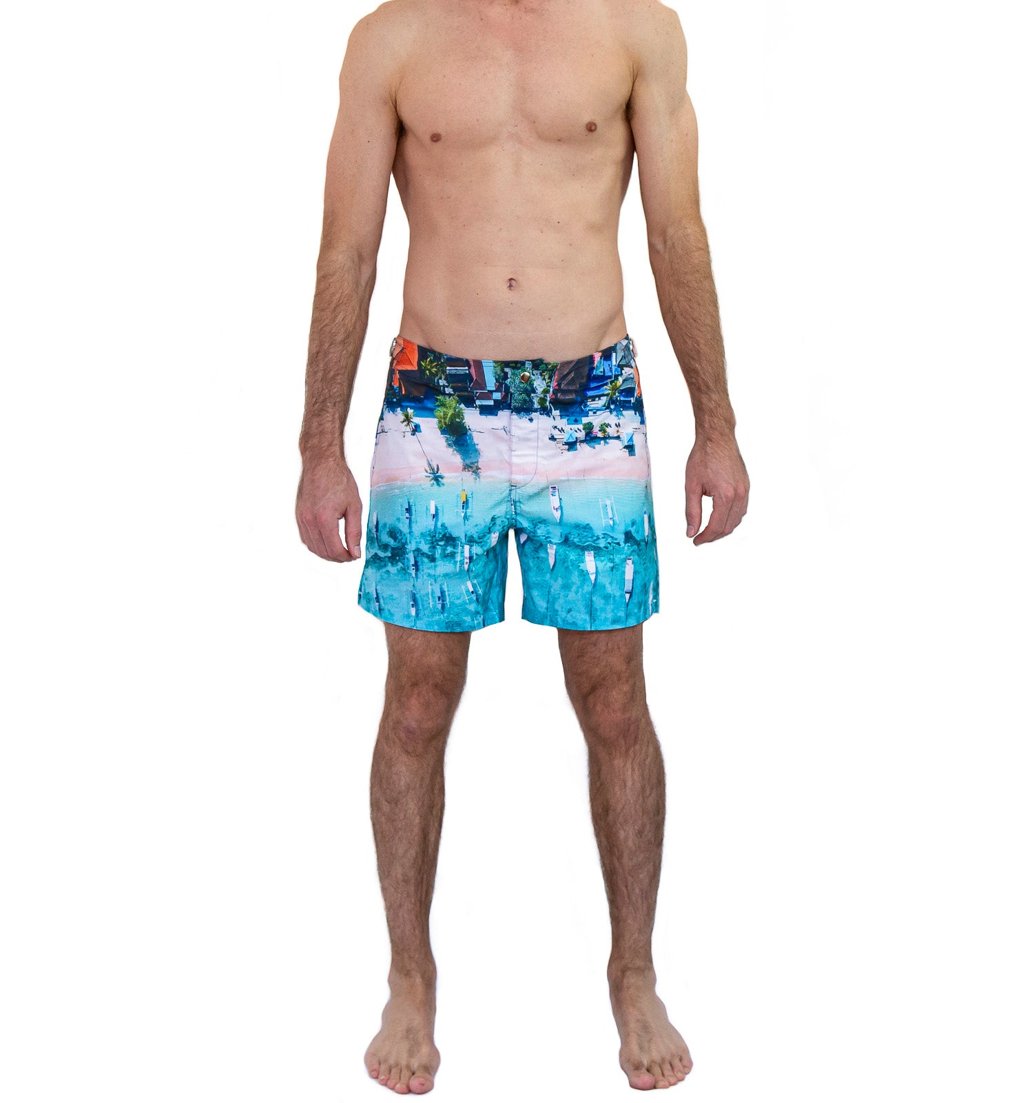 Rwenzori Bali Boats swim shorts front view – men's tailored photo-print swim trunk featuring traditional boats on a Bali coastline worn by model