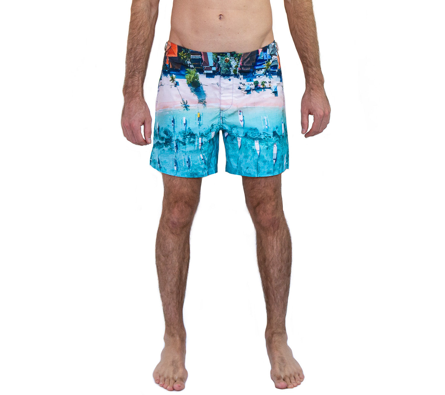 Rwenzori Bali Boats swim shorts front view – men's tailored photo-print swim trunk featuring traditional boats on a Bali coastline worn by model.