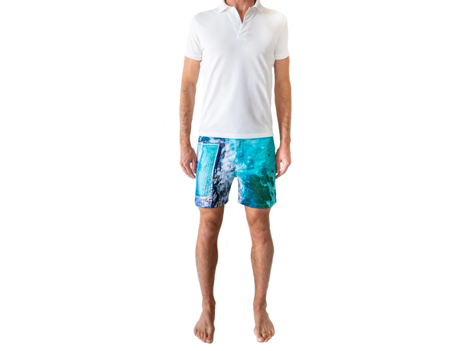 Rwenzori Bondi Beach swim shorts front view – men's tailored photo print swim trunk with iconic Bondi Beach scene With model wearing white polo shirt
