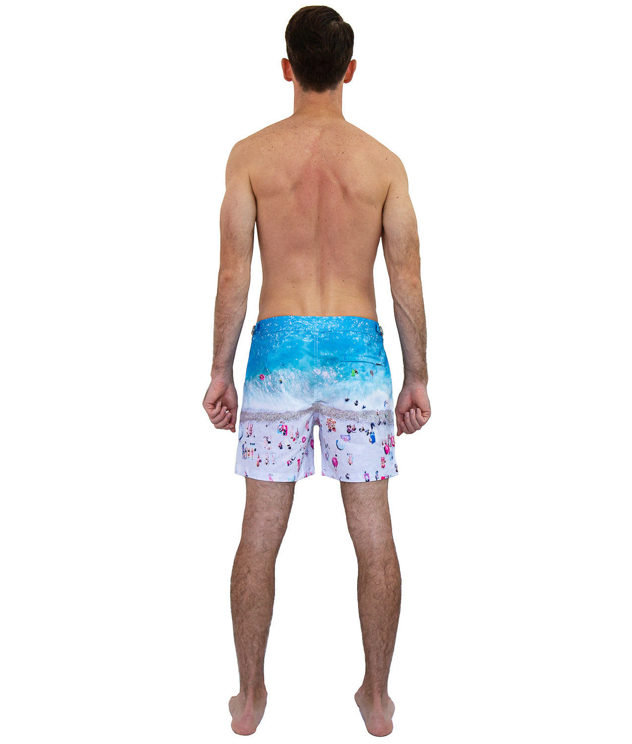 Luxury men’s swim shorts featuring French Riviera coastal print back view with zipped pocket.