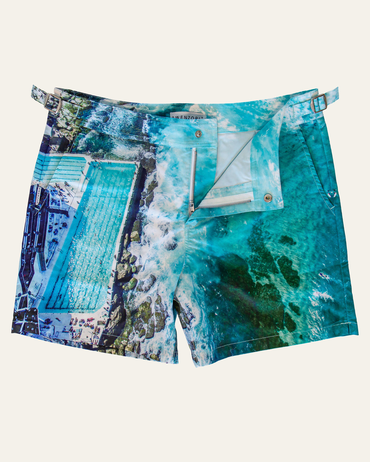 Flat lay front view of RWENZORI Bondi photo print swim shorts on a clean background.