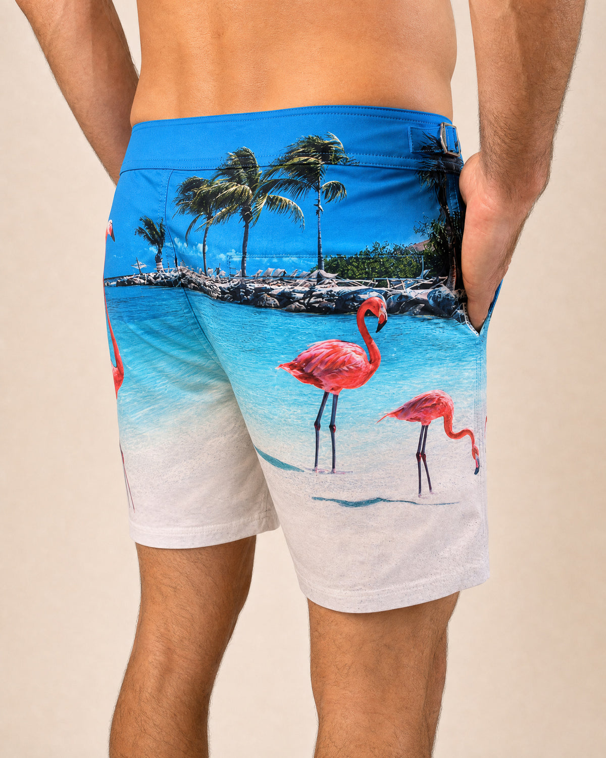 RWENZORI Flamingos photo print swim shorts — close-up rear view.