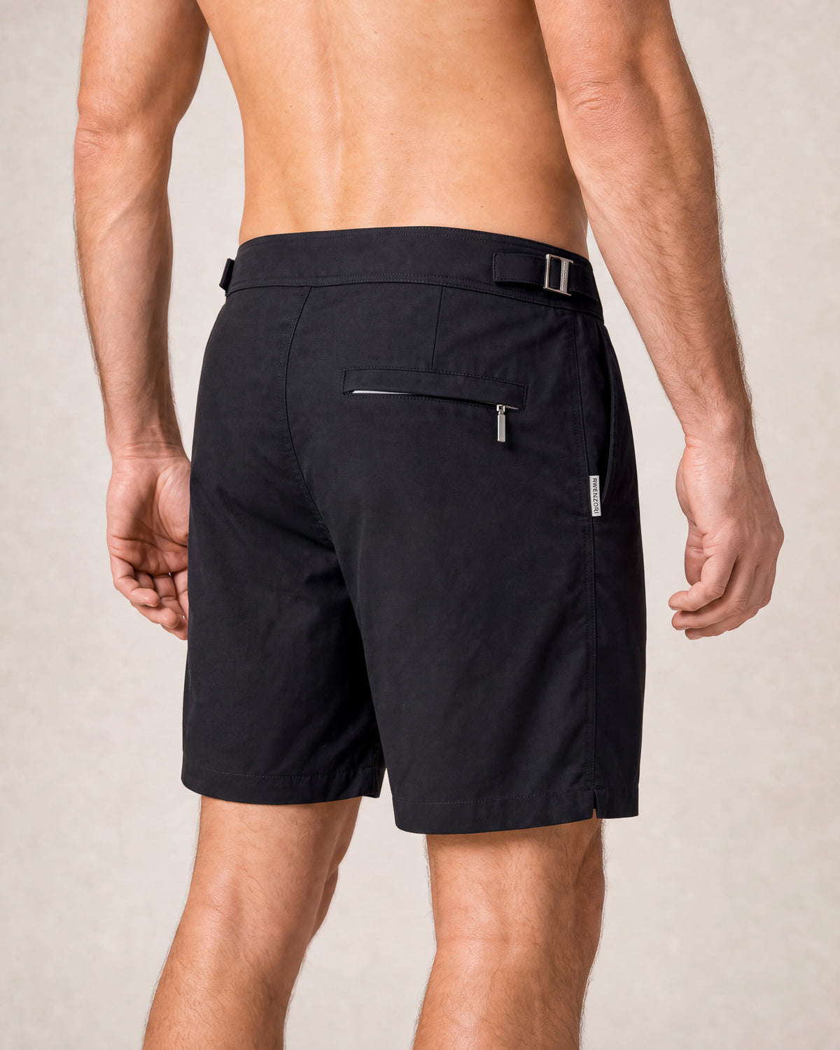 RWENZORI Jet Black Performance Series swim shorts — close-up rear view.