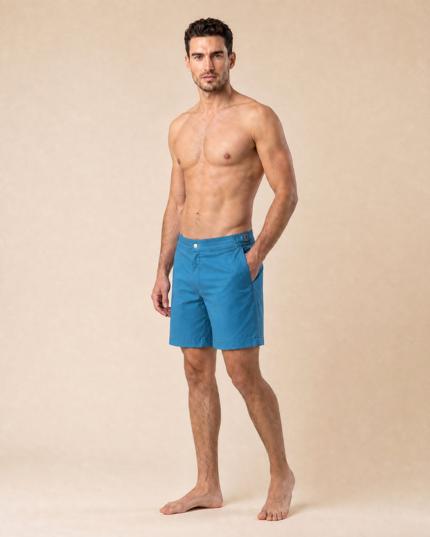 Flat lay front view of RWENZORI Mykonos Blue Performance Series swim shorts on a clean background.