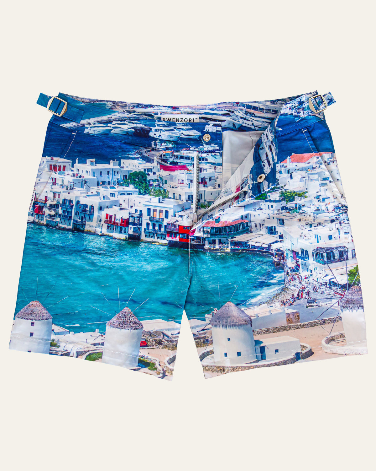 Flat lay front view of RWENZORI Mykonos photo print swim shorts on a clean background.
