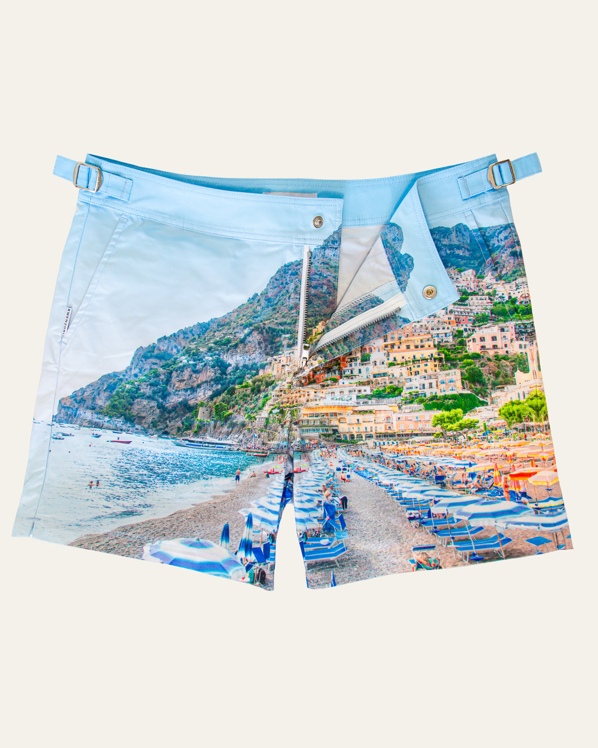 Flat lay front view of RWENZORI Positano photo print swim shorts on a clean background.