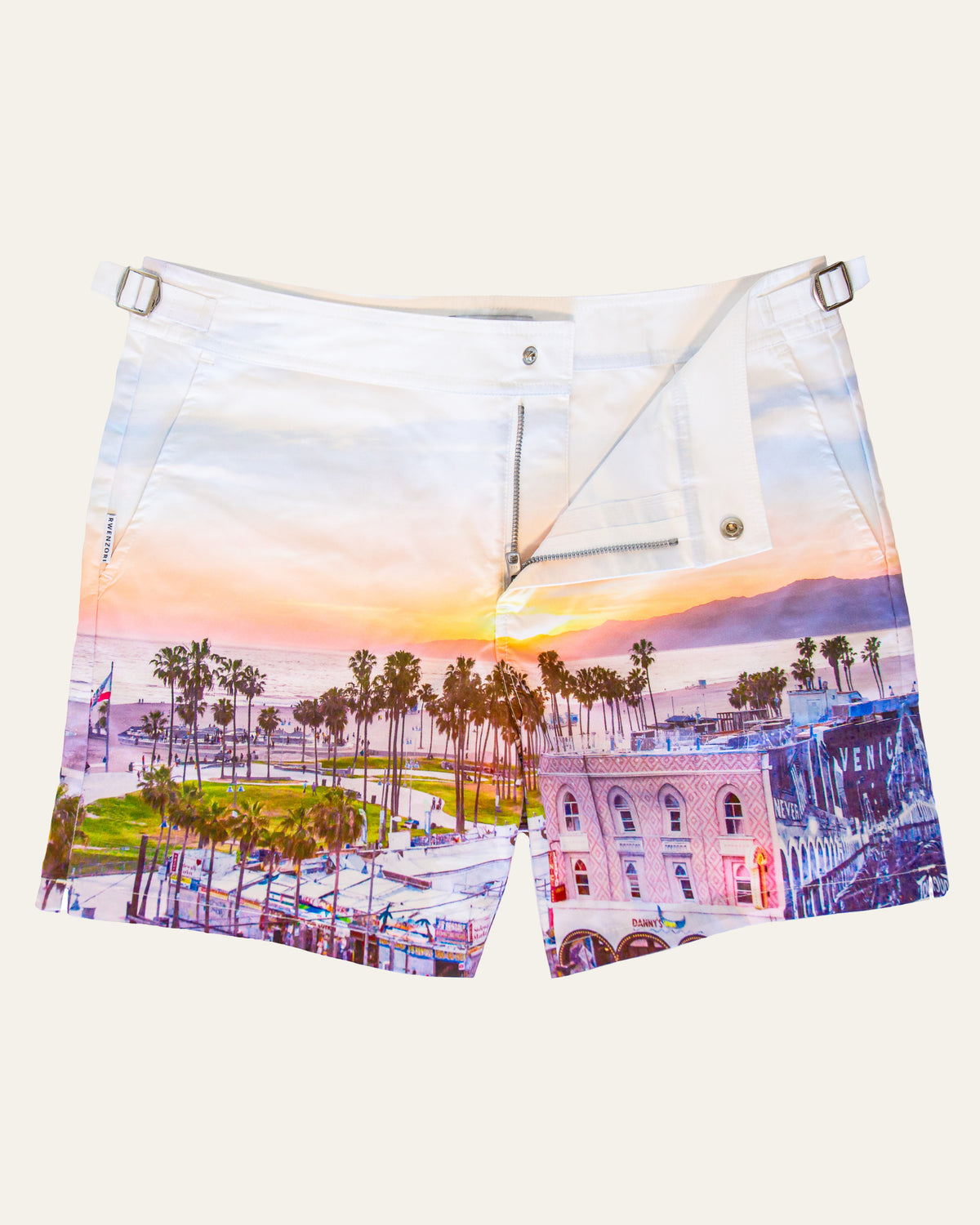 Flat lay front view of RWENZORI Venice Beach photo print swim shorts on a clean background.