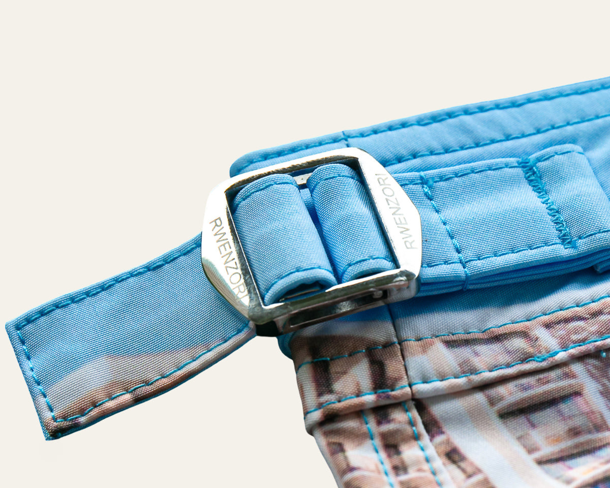 Rwenzori photo print swim trunks finer details - Waikiki buckles closeup.