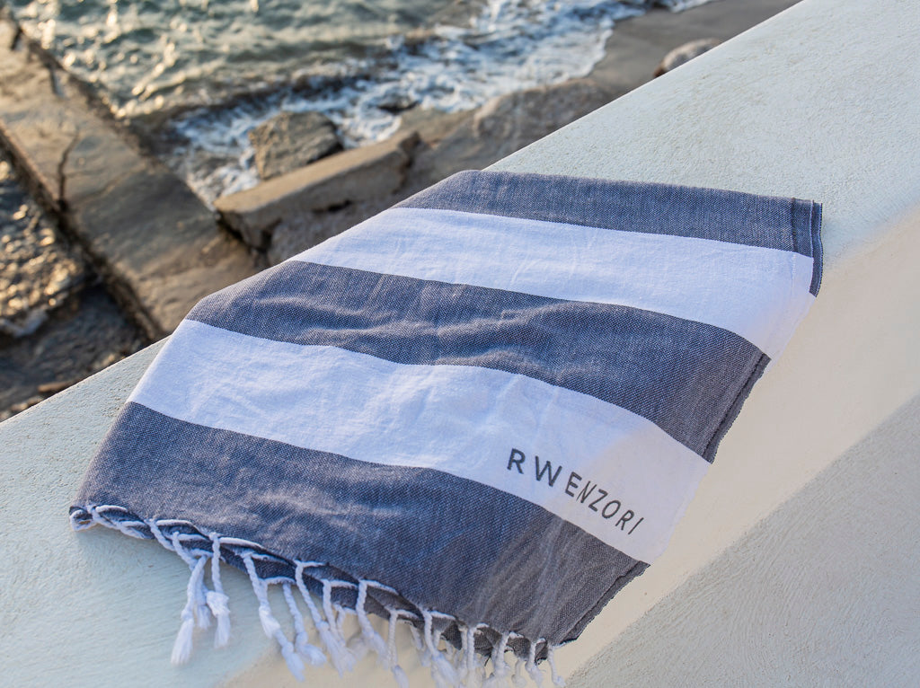 Rwenzori Turkish Peshtemal beach towel made from 100% Turkish cotton with double band design coastal charcoal grey and white.