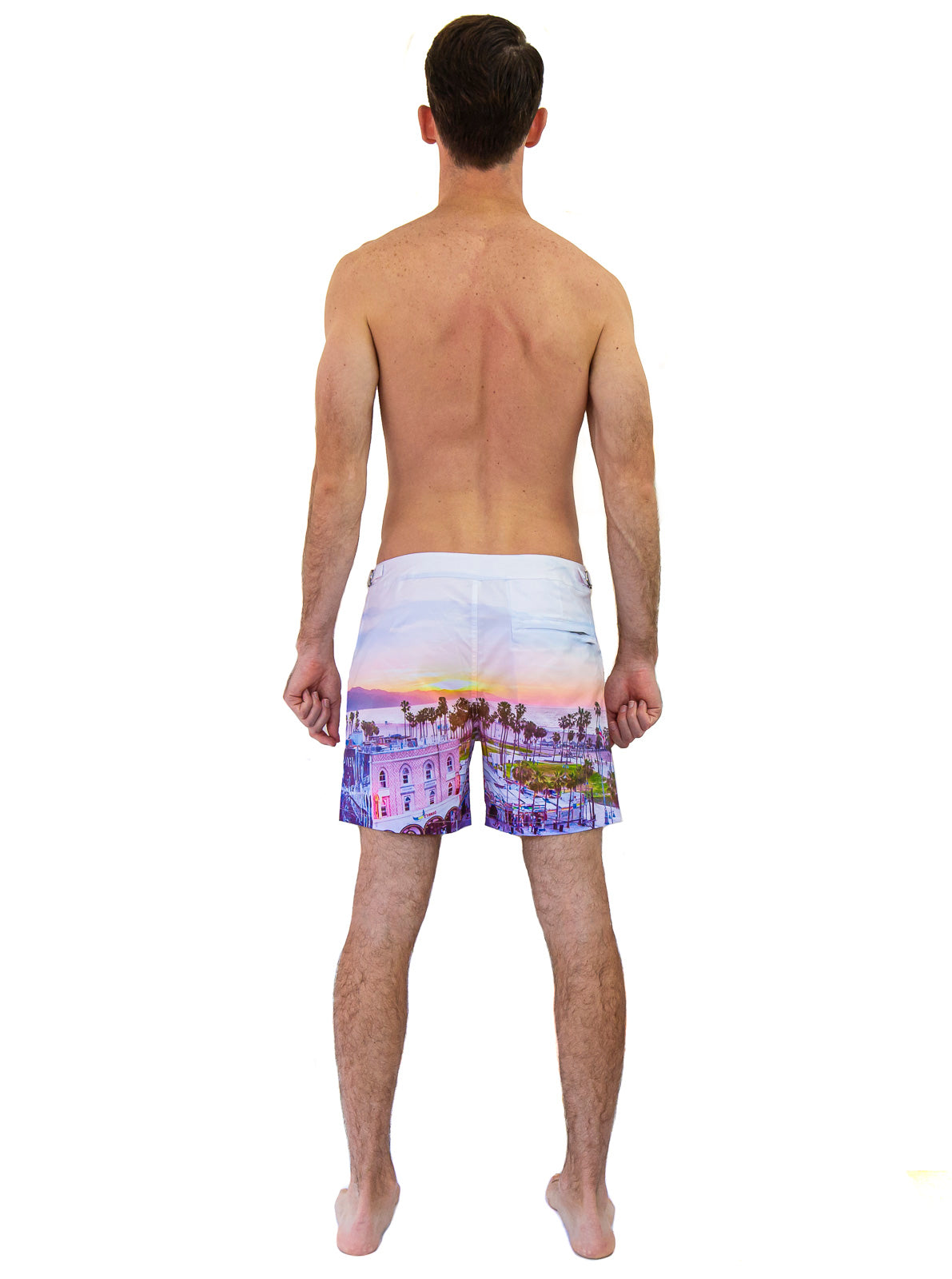 Rwenzori Venice Beach swim shorts back view – featuring Venice Beach boardwalk photo print at sunset worn by model