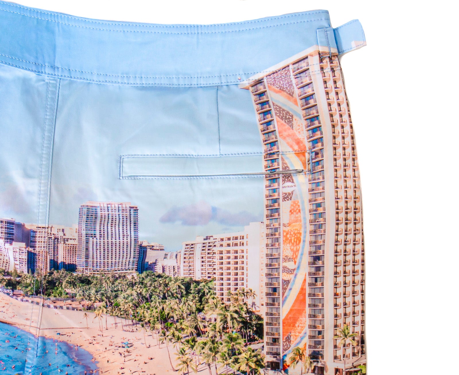 Close-up of Rwenzori Waikiki swim shorts showing vivid photo print and premium fabric texture including rear pocket